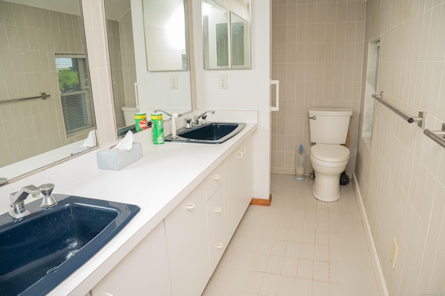 28 Morgan Ter, East Haven, CT 06512 - bathroom featuring tile walls, tile patterned flooring, toilet, and double vanity