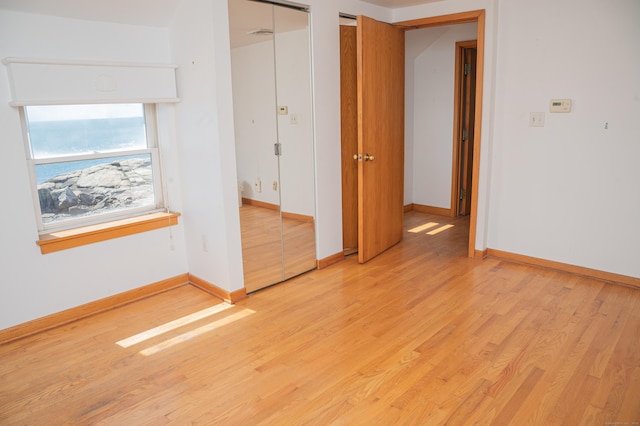 28 Morgan Ter, East Haven, CT 06512 - unfurnished bedroom featuring light wood-style floors and baseboards