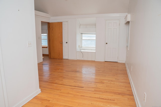 28 Morgan Ter, East Haven, CT 06512 - empty room featuring healthy amount of natural light, light wood finished floors, baseboards, and vaulted ceiling