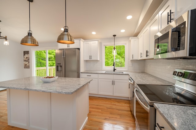 62 Wheeler Hill Dr, Durham, CT 06422 - kitchen featuring stainless steel appliances, a sink, healthy amount of natural light, light wood-type flooring, and recessed lighting