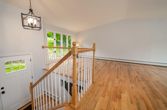 62 Wheeler Hill Dr, Durham, CT 06422 - staircase with baseboard heating, wood finished floors, plenty of natural light, a chandelier, and lofted ceiling