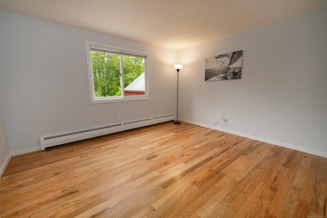 62 Wheeler Hill Dr, Durham, CT 06422 - empty room with a baseboard heating unit, wood finished floors, and baseboards