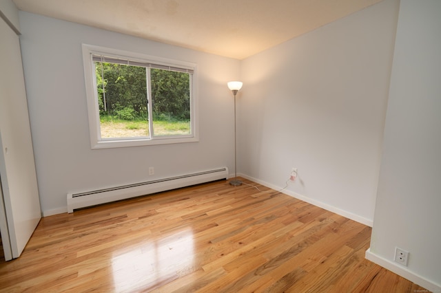 62 Wheeler Hill Dr, Durham, CT 06422 - unfurnished room with a baseboard radiator, light wood finished floors, and baseboards