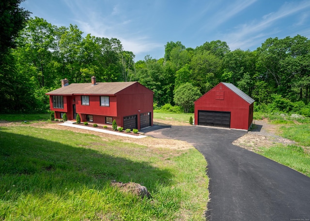 62 Wheeler Hill Dr, Durham, CT 06422 - raised ranch with a detached garage, an outdoor structure, a chimney, and a front yard
