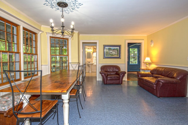 440 Mapleton Ave, Suffield, CT 06078 - dining room with a chandelier, crown molding, a wainscoted wall, and baseboard heating