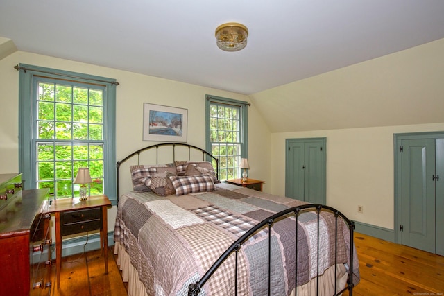 440 Mapleton Ave, Suffield, CT 06078 - bedroom with hardwood / wood-style floors, vaulted ceiling, and a baseboard radiator