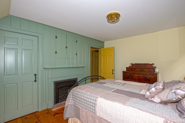 440 Mapleton Ave, Suffield, CT 06078 - bedroom with wood finished floors and a fireplace