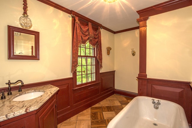 440 Mapleton Ave, Suffield, CT 06078 - full bath with wainscoting, vanity, a freestanding tub, and crown molding