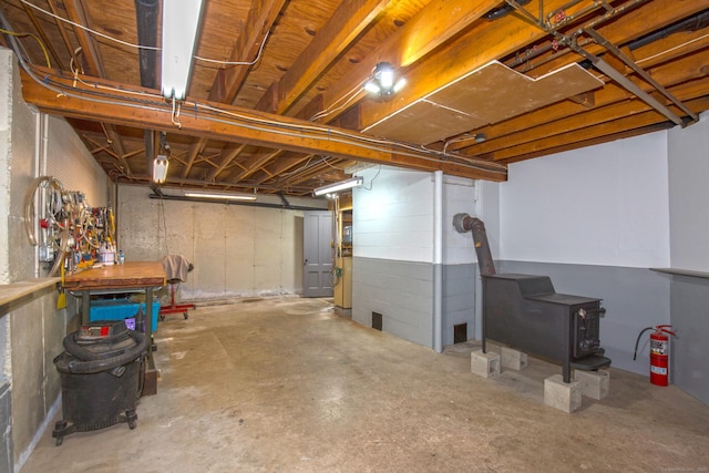 440 Mapleton Ave, Suffield, CT 06078 - unfinished basement with a wood stove