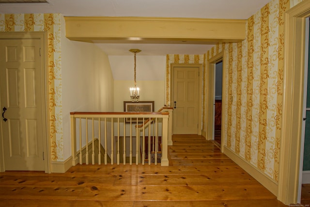 440 Mapleton Ave, Suffield, CT 06078 - hall with an upstairs landing, hardwood / wood-style flooring, wallpapered walls, a chandelier, and beam ceiling