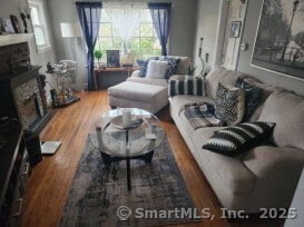 230 Winsted Rd, Torrington, CT 06790 - living room featuring a fireplace and wood finished floors