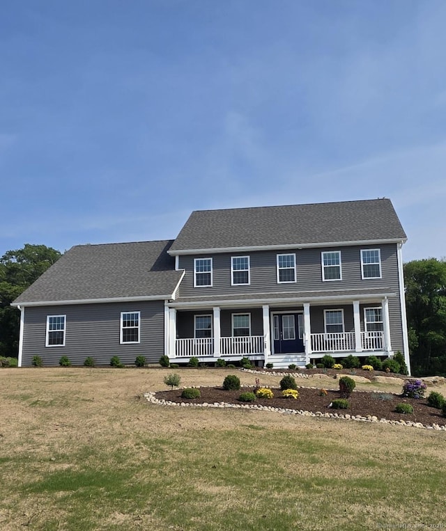26 Farm View Dr, Norwich, CT 03660 - colonial house with covered porch and a front yard