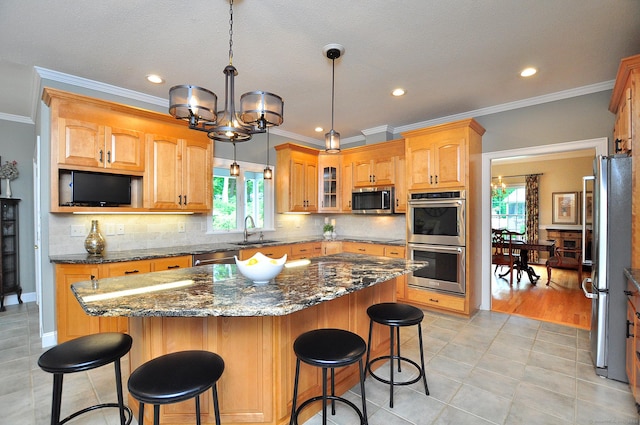 151 Oakridge, Farmington, CT 06085 - kitchen with appliances with stainless steel finishes, a chandelier, a center island, glass insert cabinets, and crown molding