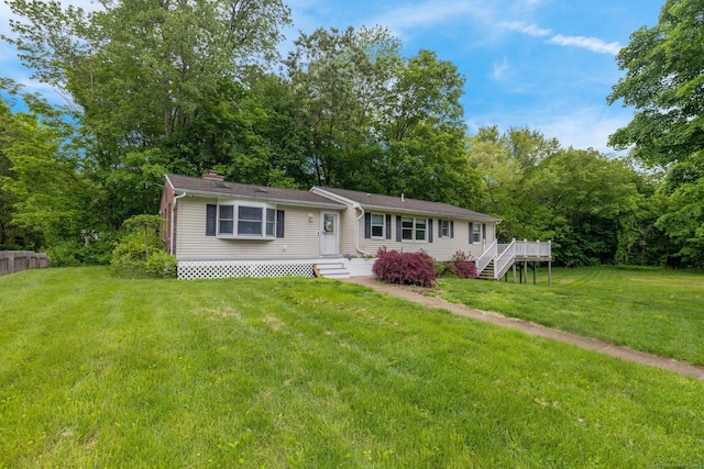 1190 Peck Ln, Cheshire, CT 06410 - single story home with a front lawn and a wooden deck