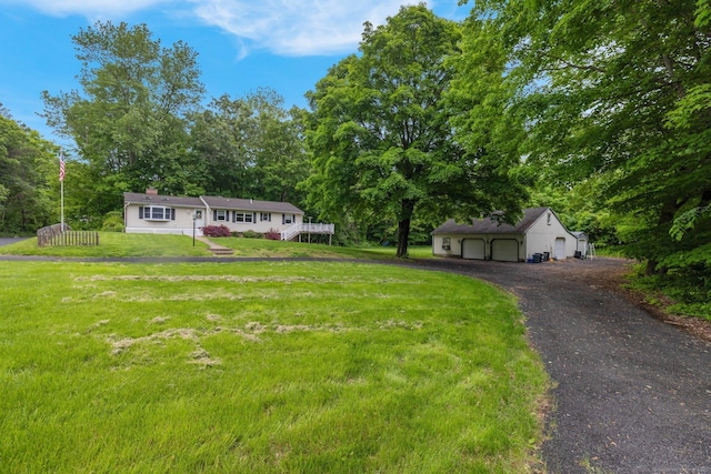 1190 Peck Ln, Cheshire, CT 06410 - ranch-style home with a garage, a front lawn, and an outbuilding