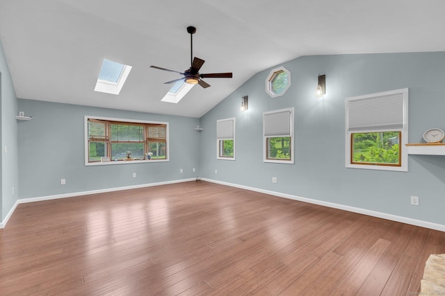1190 Peck Ln, Cheshire, CT 06410 - spare room with a skylight, wood finished floors, a ceiling fan, plenty of natural light, and high vaulted ceiling