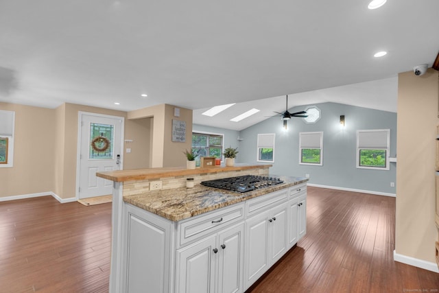 1190 Peck Ln, Cheshire, CT 06410 - kitchen featuring stainless steel gas stovetop, dark wood-type flooring, baseboards, recessed lighting, and vaulted ceiling