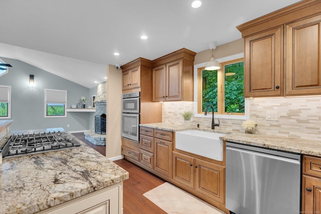 1190 Peck Ln, Cheshire, CT 06410 - kitchen with appliances with stainless steel finishes, a sink, dark wood-type flooring, tasteful backsplash, and vaulted ceiling