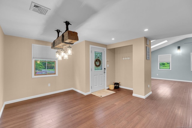 1190 Peck Ln, Cheshire, CT 06410 - foyer with wood finished floors, baseboards, and recessed lighting