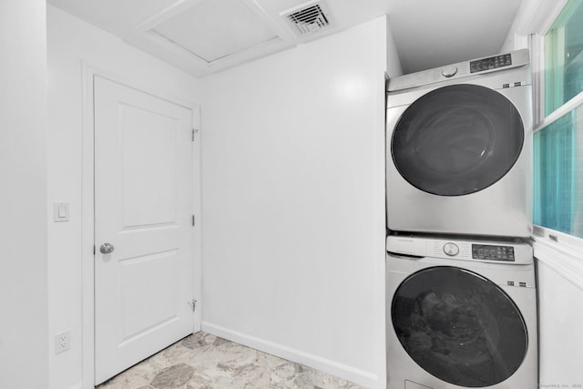 1190 Peck Ln, Cheshire, CT 06410 - washroom with stacked washer and clothes dryer, baseboards, and light marble finish floors