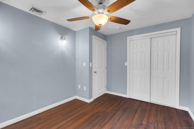 1190 Peck Ln, Cheshire, CT 06410 - unfurnished bedroom with baseboards, dark wood-style floors, a closet, and ceiling fan