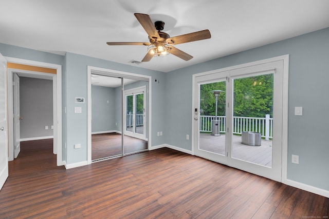 1190 Peck Ln, Cheshire, CT 06410 - unfurnished bedroom featuring access to outside, wood finished floors, multiple windows, and baseboards