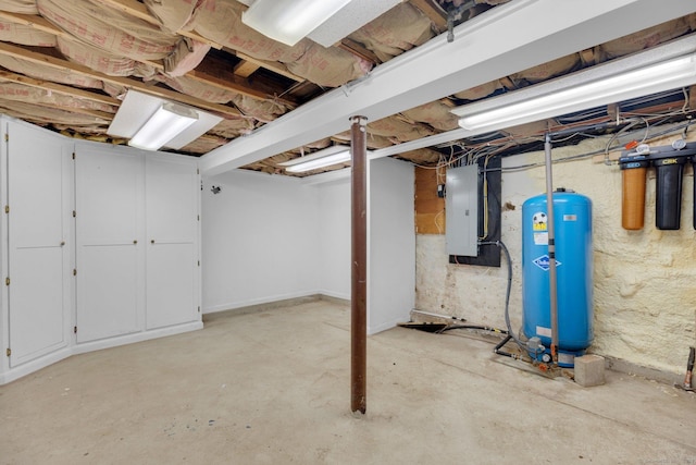 1190 Peck Ln, Cheshire, CT 06410 - unfinished below grade area featuring electric panel and a water pressure tank