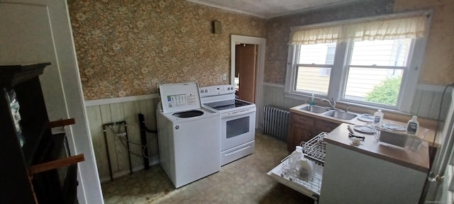 25 Richard Rd, East Hartford, CT 06108 - kitchen featuring white electric stove, radiator, a wainscoted wall, washer and clothes dryer, and wallpapered walls