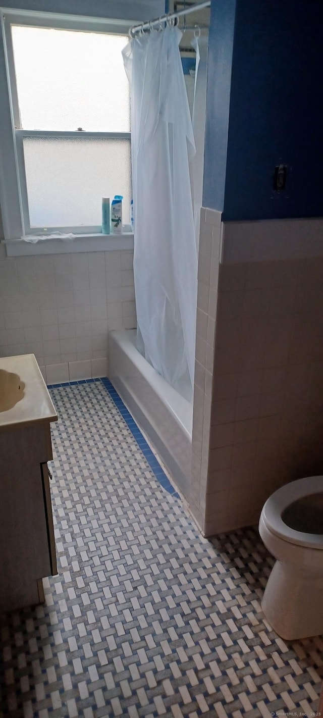 25 Richard Rd, East Hartford, CT 06108 - full bath with tile walls, vanity, and shower / bath combination with curtain