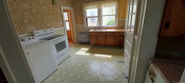 25 Richard Rd, East Hartford, CT 06108 - laundry area with radiator, washer / clothes dryer, a wainscoted wall, light flooring, and wallpapered walls