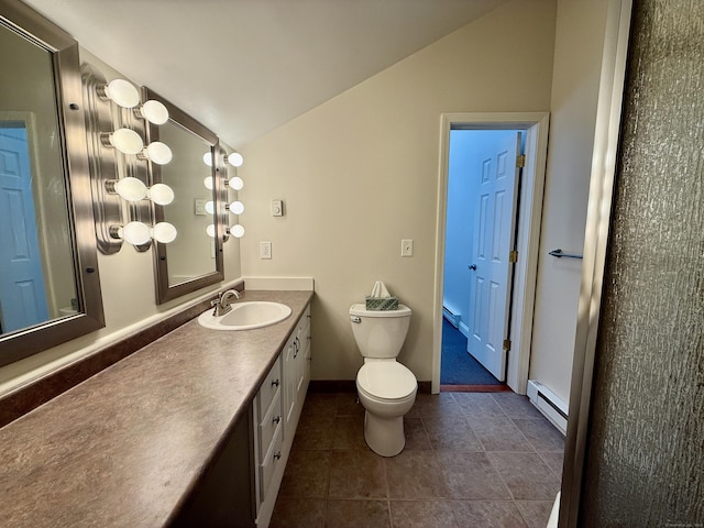 102 Beard Dr Unit 102, New Milford, CT 06776 - bathroom with baseboard heating, vaulted ceiling, toilet, vanity, and tile patterned flooring