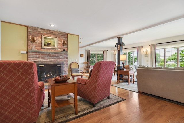 40 Holmes St, Stonington, CT 06355 - living area with wood finished floors and a fireplace