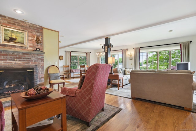 40 Holmes St, Stonington, CT 06355 - living room with wood finished floors, a fireplace, a chandelier, and recessed lighting