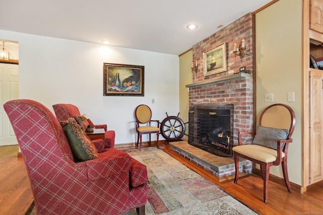40 Holmes St, Stonington, CT 06355 - living area featuring a brick fireplace, wood finished floors, baseboards, and recessed lighting