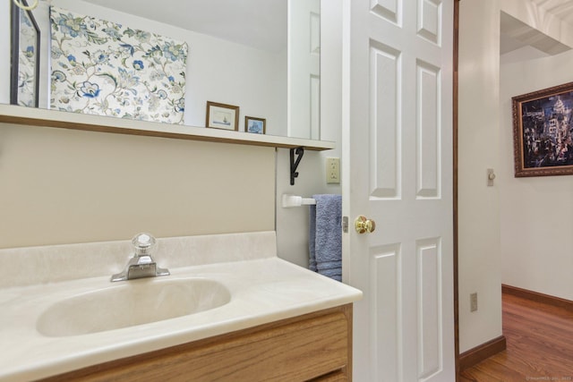 40 Holmes St, Stonington, CT 06355 - bathroom featuring vanity, wood finished floors, and baseboards