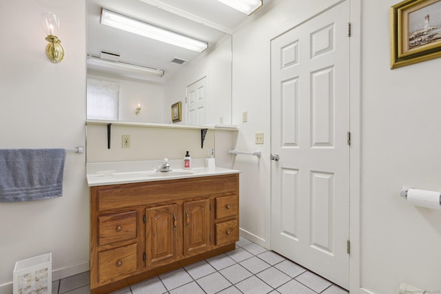 40 Holmes St, Stonington, CT 06355 - bathroom with tile patterned floors, vanity, and baseboards