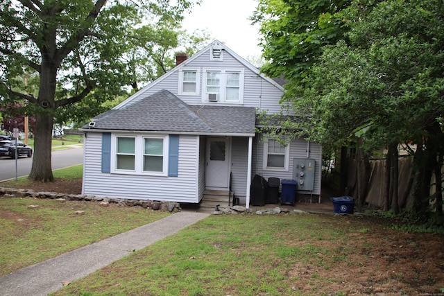 404 Center St, West Haven, CT 06516 - bungalow-style home with roof with shingles, a chimney, and entry steps