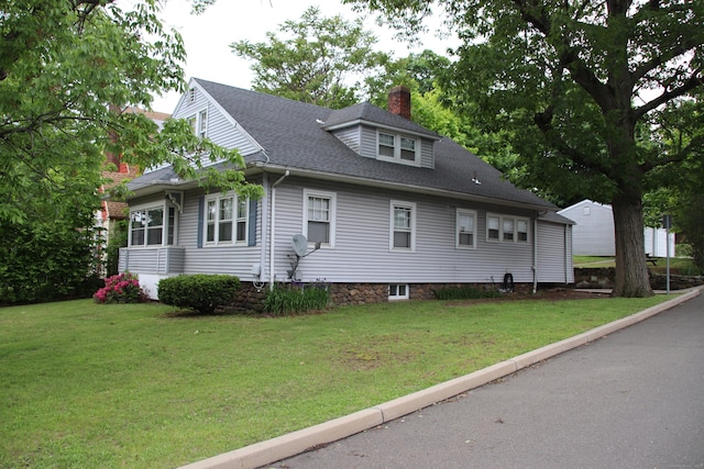 404 Center St, West Haven, CT 06516 - view of side of property featuring a chimney, a yard, and a shingled roof