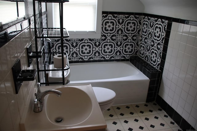 404 Center St, West Haven, CT 06516 - full bathroom featuring tile walls, a bathtub, a sink, toilet, and tile patterned flooring