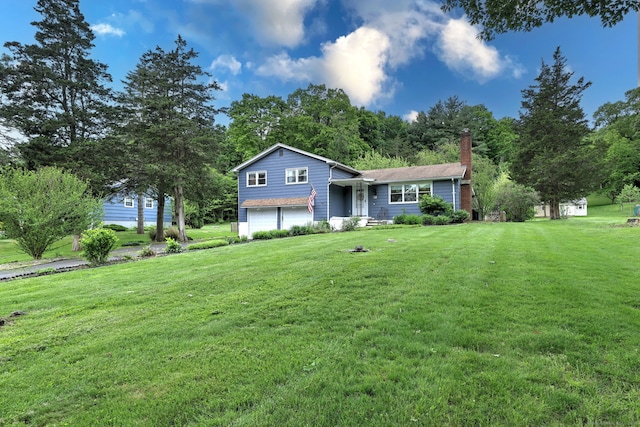 1690 Hartford Tpke, North Haven, CT 06473 - tri-level home featuring an attached garage, a front yard, and a chimney