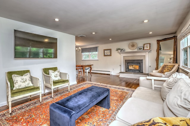 1690 Hartford Tpke, North Haven, CT 06473 - living area with wood finished floors, baseboard heating, a premium fireplace, recessed lighting, and crown molding