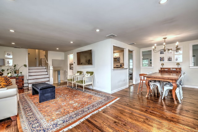 1690 Hartford Tpke, North Haven, CT 06473 - living room featuring wood finished floors, a chandelier, stairway, baseboards, and recessed lighting