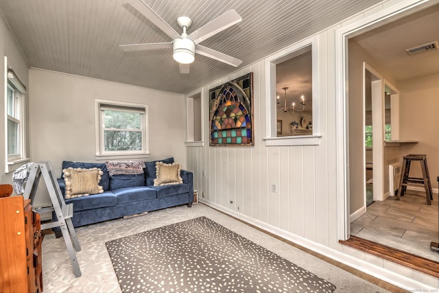 1690 Hartford Tpke, North Haven, CT 06473 - sitting room with a ceiling fan, baseboards, and wood walls
