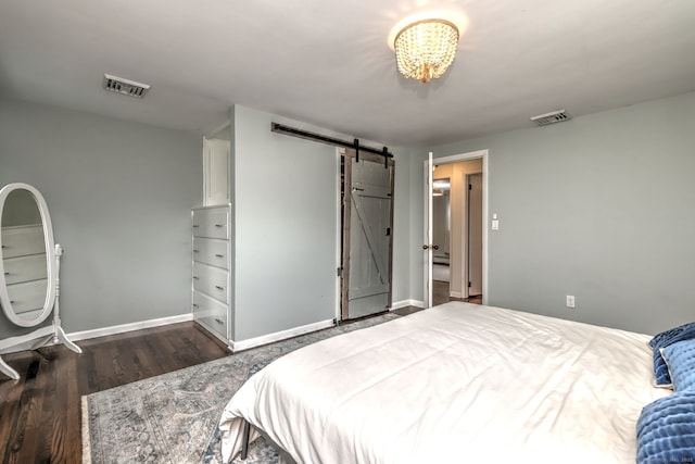 1690 Hartford Tpke, North Haven, CT 06473 - bedroom with a barn door, wood finished floors, and baseboards