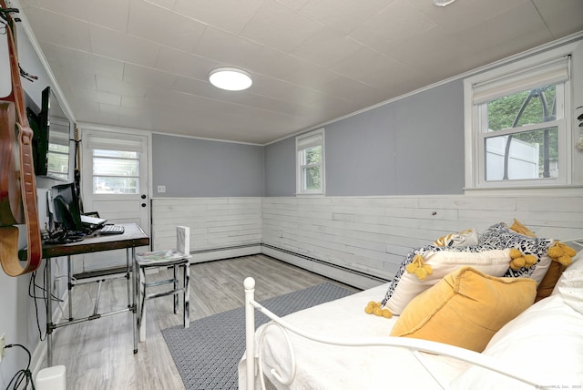 1690 Hartford Tpke, North Haven, CT 06473 - bedroom featuring multiple windows, wood finished floors, a baseboard heating unit, a wainscoted wall, and ornamental molding