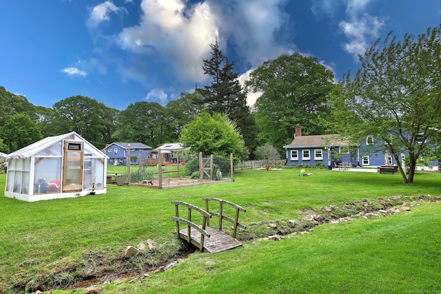 1690 Hartford Tpke, North Haven, CT 06473 - view of yard featuring an exterior structure, a vegetable garden, an outbuilding, and view of scattered trees