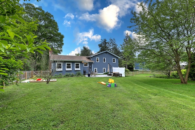 1690 Hartford Tpke, North Haven, CT 06473 - back of property with a patio area and a chimney