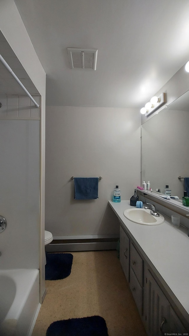 50 Highland Dr, Ledyard, CT 06339 - full bathroom featuring vanity, tile patterned floors, baseboard heating, shower / bath combination, and toilet