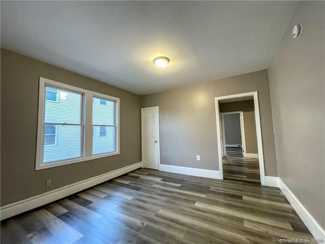 158 Martin St, Hartford, CT 06120 - spare room with baseboards, dark wood-style flooring, and a smoke detector
