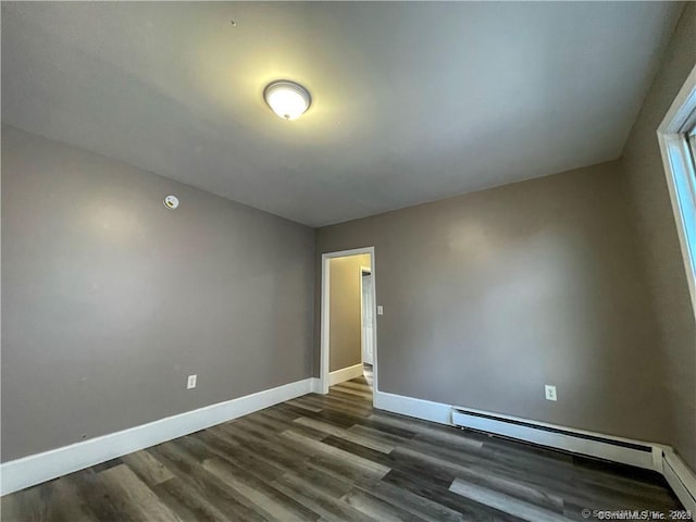 158 Martin St, Hartford, CT 06120 - empty room featuring dark wood finished floors, baseboards, and a baseboard heating unit